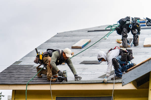 Professional Gutter Installation technician working in Mastic, NY